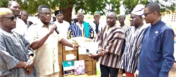 Abubakar Sadiq Abdullah (2nd from left), Ghana's Ambassador to Kuwait, handing over the items to Sule Salifu (3rd from right), Head teacher of the school. Looking on is Ahmed Yakubu, the MCE for Sagnarigu, and other staff of the school Abubakar Sadiq Abdullah (2nd from left), Ghana's Ambassador to Kuwait, handing over the items to Sule Salifu (3rd from right), Head teacher of the school. Looking on is Ahmed Yakubu, the MCE for Sagnarigu, and other staff of the school