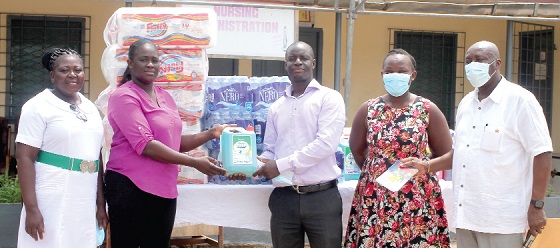 Kwasi Odame Ofori (3rd from right), Secretary of Founder's Chapter, Full Gospel Business Men's Fellowship International, presenting the items to Francisca Ntow (2nd from left), Public Relations Officer, Accra Psychiatric Hospital. Also in the photograph is Abiola Aheto Tsegah (right), President of the Founder's Chapter. Picture: Maxwell Ocloo