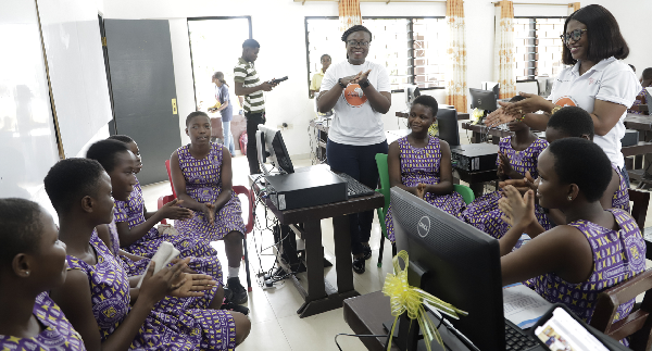 Justina Onumah, Ghanaian Ambassador for the Next Einstein Forum in an interaction with some students of the Ringway Estate Basic School during the event. Picture: EDNA SALVO-KOTEY