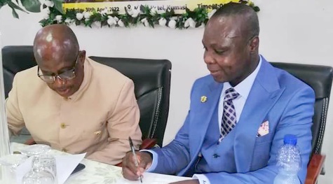 Justice Richard Agyei-Frimpong (right) conferring with Simon Osei-Mensah