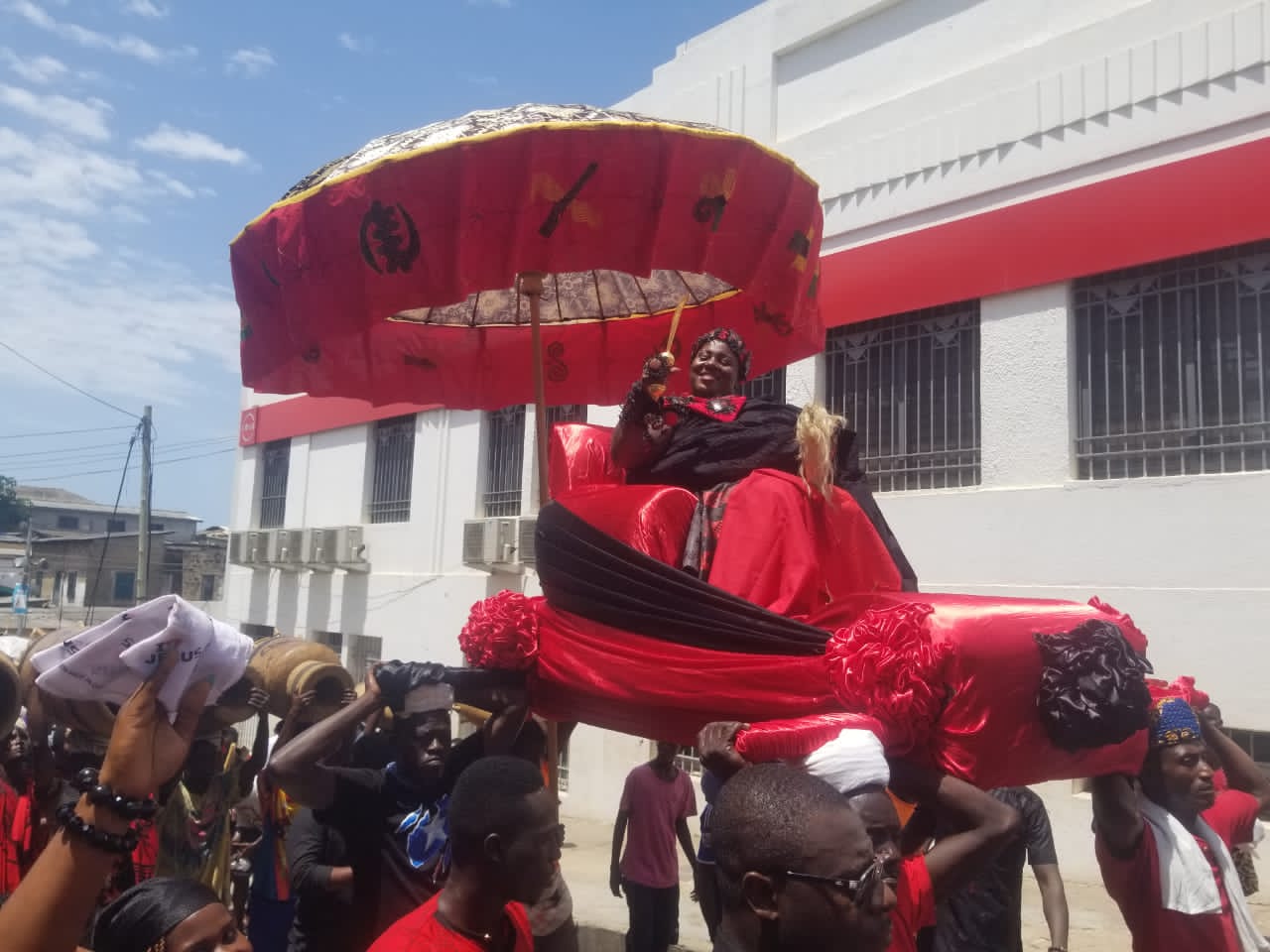 Nana Abookye VI being carried in palanquin through some principal streets of Cape Coast New Queenmother for Cape Coast Nana Akua Abookye VI outdoored