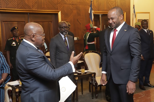 President Akufo-Addo interacting with Khamees Barkah Abraheem Hassan (right), the Libyan Ambassador to Ghana. Pictures: SAMUEL TEI ADANO