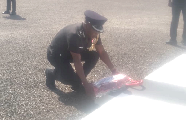 DCOP Darko Offei Lomotey, Upper East Regional Police Commander, laying a wreath on behalf of Dr George Akuffo Dampare, the Inspector General of Police