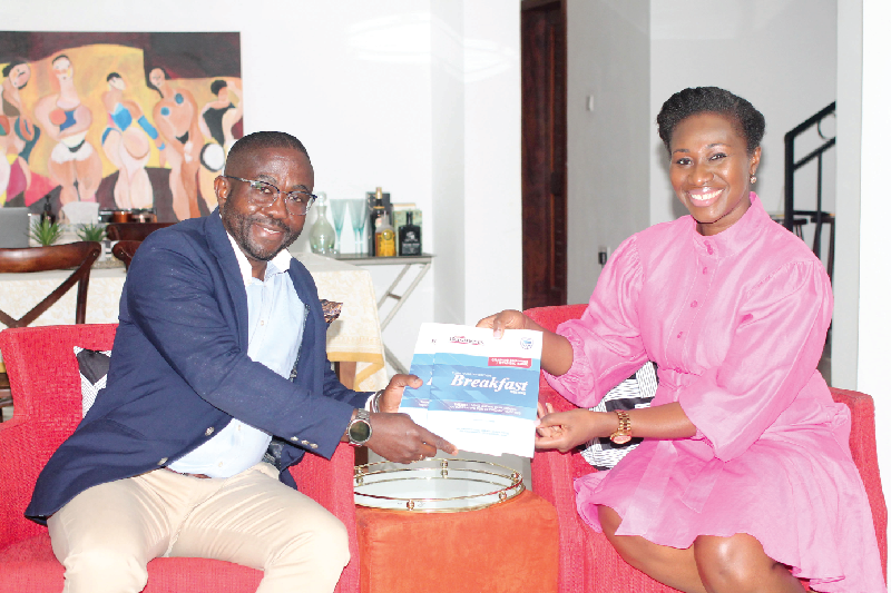 Charles Benoni Okine, acting Editor, Graphic Business, presenting copies of the report to Adoma Peprah (right), Country Manager, VISA Ghana. Picture: MAXWELL OCLOO Businesses urged to leverage e-Commerce platforms