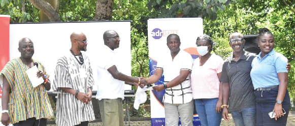 Boaz Ofosu-Asiedu (3rd from left) handing over the Mediation Practice Manual received from Togbe Amedzake (left) to Nana Aduhene  Adu-Darko, the 2022 ADR class leader