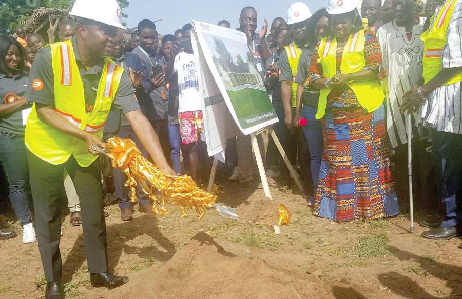 • Atta Yeboah Gyan (left), Deputy Managing Director, Operations and Support Functions, Fidelity Bank cutting the sod for the project to commence Fidelity Bank launches nationwide corporate social responsibility initiative