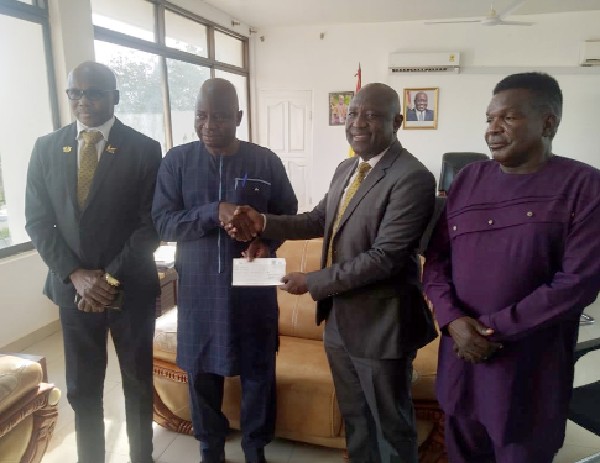 Alhaji Mohammed Mipo, GCB Bank Regional Manager in charge of the five northern regions (2nd from right) presenting a cheque to Stephen Yakubu, the Upper East Regional Minister (2nd from left). Looking on are Sheihu Abdulai, GCB Branch Manager, Bolgatanga, and Jerry Asamani, the Upper East Regional NADMO Director Alhaji Mohammed Mipo, GCB Bank Regional Manager in charge of the five northern regions (2nd from right) presenting a cheque to Stephen Yakubu, the Upper East Regional Minister (2nd from left). Looking on are Sheihu Abdulai, GCB Branch Manager, Bolgatanga, and Jerry Asamani, the Upper East Regional NADMO Director