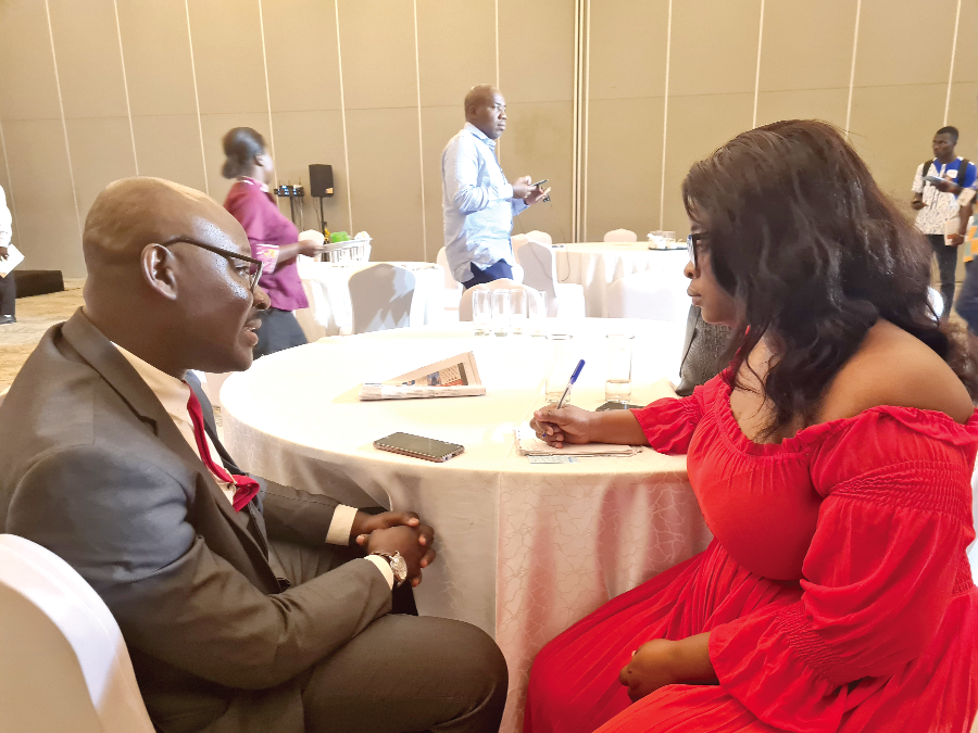 Kwame Osei (left), Sales and Marketing Manager of Samara Company Ltd, speaking to Delali Sika, Daily Graphic reporter Kel Toothpaste Best Oral Care Product of the year