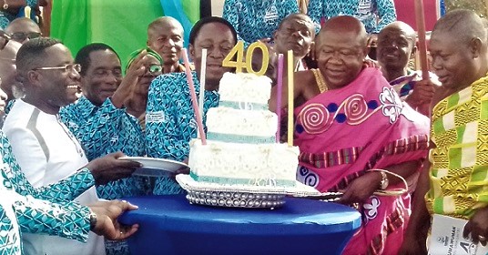 Dr Kwabena Duffour (3rd from left), first Board Chairman of the bank, and Barima Sarfo Tweneboa Kodua (2nd from right), the Paramount Chief of Kumawu, being assisted to cut the anniversary cake Dr Kwabena Duffour (3rd from left), first Board Chairman of the bank, and Barima Sarfo Tweneboa Kodua (2nd from right), the Paramount Chief of Kumawu, being assisted to cut the anniversary cake
