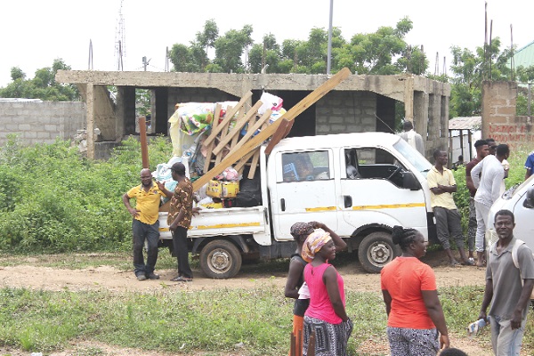 Some victims of the demolition exercise relocating their belongings. Picture: ERNEST KODZI