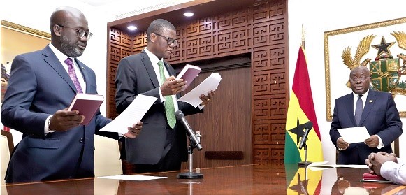 President Akufo-Addo (right) swearing in Yaw Bimpong (left), Ambassador to Algeria, and Maxwell Awiaga, Ambassador to Guinea, at the Jubilee House. Picture: SAMUEL TEI ADANO President Akufo-Addo (right) swearing in Yaw Bimpong (left), Ambassador to Algeria, and Maxwell Awiaga, Ambassador to Guinea, at the Jubilee House. Picture: SAMUEL TEI ADANO