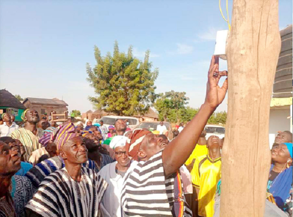 Abdul-Salam Hamza Abdul-Fatawu, (right), DCE for Kumbungu, being assisted by some opinion leaders to inaugurate the project Abdul-Salam Hamza Abdul-Fatawu, (right), DCE for Kumbungu, being assisted by some opinion leaders to inaugurate the project