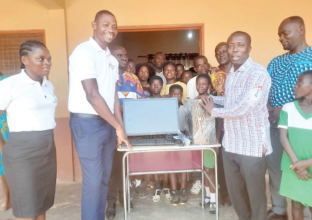 Owusu Banahene (3rd from right), Headmaster of Feyiase Roman Catholic Primary School, receiving the items from Enoch Sunday Tiavor, Assistant Managing Director of the foundation Owusu Banahene (3rd from right), Headmaster of Feyiase Roman Catholic Primary School, receiving the items from Enoch Sunday Tiavor, Assistant Managing Director of the foundation