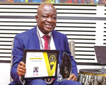 Prof. Frank Sena Arku displaying his award Prof. Frank Sena Arku displaying his award