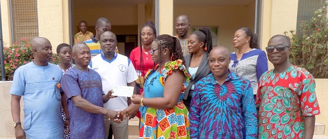 Benedicta Addo-Danquah (3rd from right) presenting the cheque to Evans Boafo, the Headmaster of ODASCO. With them are Augustus Anim Attafuah (2nd from right) and Paul Asiedu (right), a board member of the bank. Behind them are other board members of the bank. Benedicta Addo-Danquah (3rd from right) presenting the cheque to Evans Boafo, the Headmaster of ODASCO. With them are Augustus Anim Attafuah (2nd from right) and Paul Asiedu (right), a board member of the bank. Behind them are other board members of the bank.