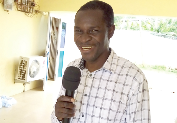 Eben Kwaku Fenuku (inset), Chairman of the Lower Manya Krobo Teachers Association, addressing the delegates 