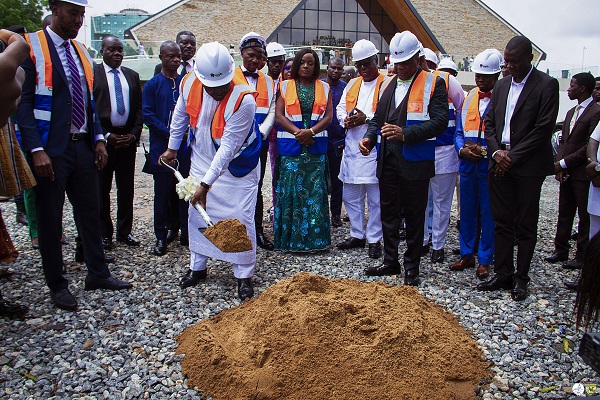 Former President, John Dramani Mahama (with shovel) performing the ground breaking activity. On looking are Rev. Dr Stephen Wengam (2nd right), General Superintendent, A-G Ghana, and other dignitaries at the event. CMC