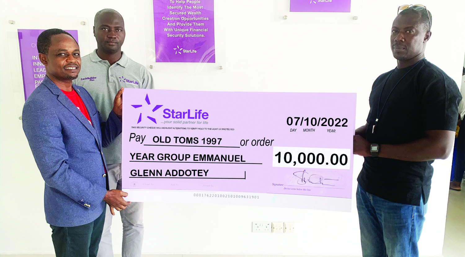 Alexander Twumasi (left), Head, Commercial Business of StarLife Assurance, Ebenezer Opoku Osae (2nd left), Supervisor, Corporate Unit, StarLife Assurance, presenting the cheque to Emmanuel Glenn Addotey (right). StarLife Assurance pays first claim for ‘My Clique’ policy