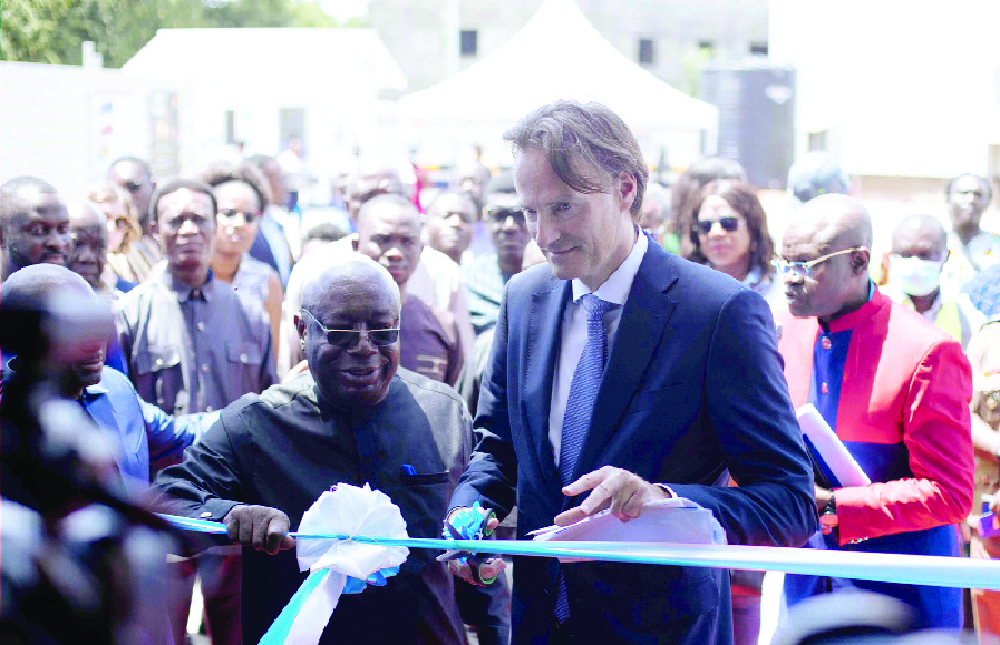 Christian Stammkoetter (right), President, Danone, assisted by Dr Kwadwo Afriyie (left), Minister of Environment, Science, Technology and Innovation, to cut the tape to inaugurate the Wastewater Treatment plant FanMilk PLC inaugurates €7m green projects