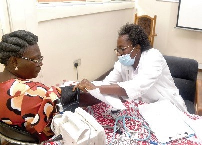 Lydia Siaw-Lartey (right), a Senior Nursing Officer at the Graphic Clinic, checking the blood pressure of a GCGL staff member. Picture: ESTHER ADJORKOR ADJEI Lydia Siaw-Lartey (right), a Senior Nursing Officer at the Graphic Clinic, checking the blood pressure of a GCGL staff member. Picture: ESTHER ADJORKOR ADJEI