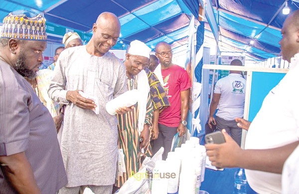 Shani Alhassan Shaibu (2nd from left), the Northern Regional Minister, examining one of the products on display at the exhibition yesterday Shani Alhassan Shaibu (2nd from left), the Northern Regional Minister, examining one of the products on display at the exhibition yesterday