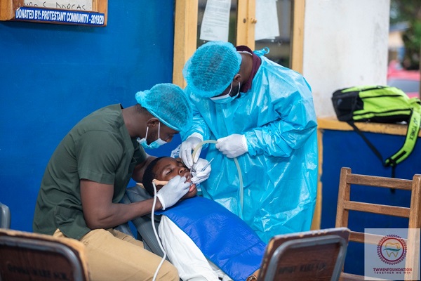 The dental team attending to a resident Foundation organises free dental screening for Manhyia