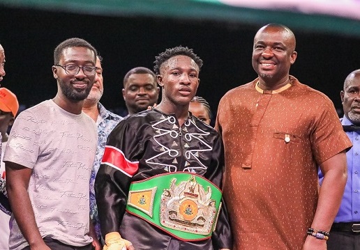 Michael Decardi-Nelson poses with Ghana Boxing Authority President, Abraham Kotei Neequaye (right) and Emmanuel Asamoah, Country Management of Ghana Binance, after being decorated with the title belt Michael Decardi-Nelson poses with Ghana Boxing Authority President, Abraham Kotei Neequaye (right) and Emmanuel Asamoah, Country Management of Ghana Binance, after being decorated with the title belt
