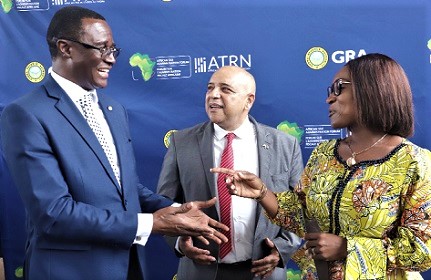 Abena Osei-Asare (right), Deputy Minister of Finance in charge of Revenue, interacting with Rev. Dr Ammishaddai Owusu-Amoah (left), Commissioner-General, GRA, after the opening ceremony. With them is Logan Wort (middle), Executive Secretary, ATAF.  Picture: SAMUEL TEI ADANO