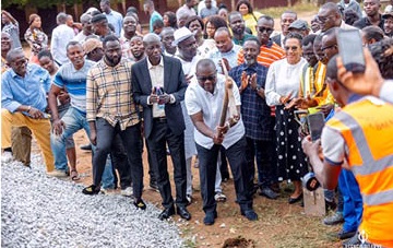 Francis Asenso-Boakye (with pickaxe), MP for Bantama, cutting the sod for the project to commence. 