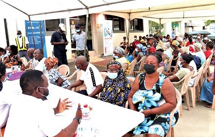 A medical staff attending to some patrons at the Graphic Clinic screening exercise. 