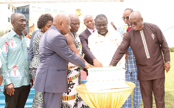 Kwaku Ofori-Asiamah (3rd from right), Transport Minister, being assisted by dignitaries, including Kwaku Agyemang-Manu (3rd from left), Health Minister, to cut the anniversary cake. Picture: DELLA RUSSEL OCLOO Kwaku Ofori-Asiamah (3rd from right), Transport Minister, being assisted by dignitaries, including Kwaku Agyemang-Manu (3rd from left), Health Minister, to cut the anniversary cake. Picture: DELLA RUSSEL OCLOO