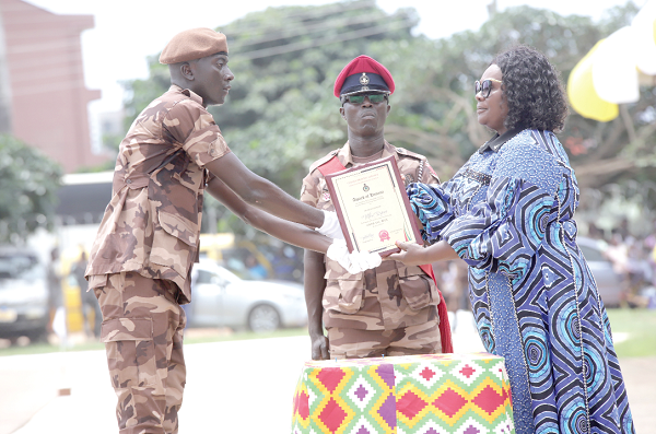 Naana Eyiah (right), a Deputy Minister for the Interior, presenting the Overall Best Recruit Officer award to Prince Mbri (left), at the ceremony. Picture: Samuel Tei Adano Naana Eyiah (right), a Deputy Minister for the Interior, presenting the Overall Best Recruit Officer award to Prince Mbri (left), at the ceremony. Picture: Samuel Tei Adano