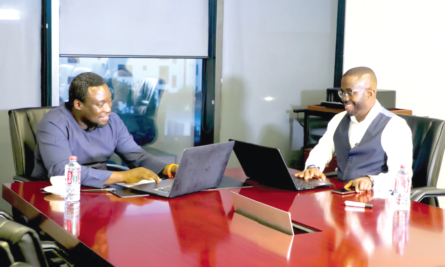 Dr Sam Ankrah (left), Development Economist, being interviewed by Charles Benoni Okine, acting Editor, Graphic Business Finding sustainable means to strengthen cedi