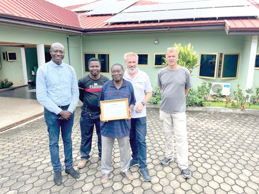 Dr Ebenezer Osei-Kofi (with certificate), owner of the lodge with some team members of Ewia Green Investment GmBH Osko Lodge goes green with switch to solar energy