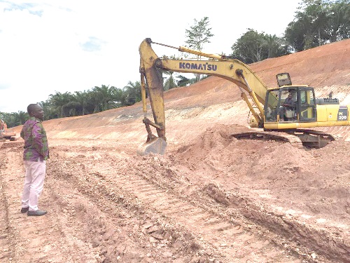 The DCE inspecting work on the approach road to the bridge under construction