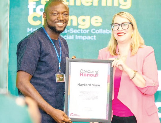 • Sofia Breitholtz (right), CEO of Reach For Change, presenting the citation to Hayford Siaw • Sofia Breitholtz (right), CEO of Reach For Change, presenting the citation to Hayford Siaw