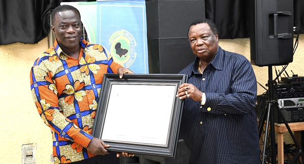 • Ignatius Baffour Awuah, Minister of Employment and Labour Relations, receiving a certificate of honour from Dr Francis Atwoli, President of OATUU, on behalf of Nana Addo Dankwa Akufo-Addo, President of Ghana. Picture: EBOW HANSON • Ignatius Baffour Awuah, Minister of Employment and Labour Relations, receiving a certificate of honour from Dr Francis Atwoli, President of OATUU, on behalf of Nana Addo Dankwa Akufo-Addo, President of Ghana. Picture: EBOW HANSON