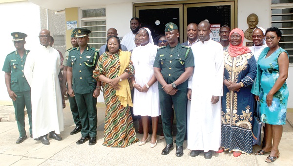 Isaac Ghansah (2nd from left), Assistant Commissioner of Immigration; Sr Regina Ignatia Aflah (4th from left), Project Coordinator, Human Rights and Justice, Caritas Ghana; Clara K. Beeri Kasser-Tee (3rd from left), member, Caritas Ghana, and some participants in the launch