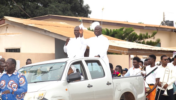 Very Rev. Fr Donkor-Baine (arrowed) responding to cheers during the procession Very Rev. Fr Donkor-Baine (arrowed) responding to cheers during the procession