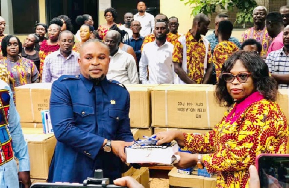 John Kwame Duodu presenting the items to Juliana Essel-Cudjoe John Kwame Duodu presenting the items to Juliana Essel-Cudjoe