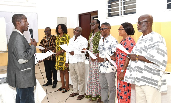 Lawrence Morlemetor Avevor (left), Past President of G-78 of KETASCO and Chairman of the 70th anniversary planning committee, administering the oath to the newly elected executive members of the Keta Old Students Association. Picture: EBOW HANSON Lawrence Morlemetor Avevor (left), Past President of G-78 of KETASCO and Chairman of the 70th anniversary planning committee, administering the oath to the newly elected executive members of the Keta Old Students Association. Picture: EBOW HANSON