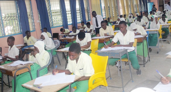 Philip Aidoo, Director of Education for Ayawaso North Municipality, observing some candidates writing the Religious and Moral Education paper at the Accra Girls’ Senior High School at Mamobi In Accra. Picture: ESTHER ADJORKOR ADJEI