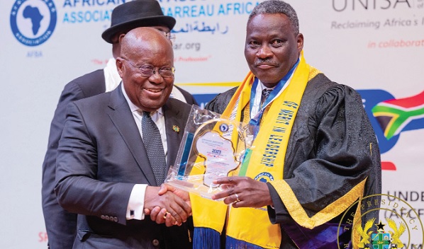 President Akufo-Addo (left), receiving the award from Hannibal Egbe Uwaifo, President of the association, at the 2023 Annual Conference of the African Bar Association President Akufo-Addo (left), receiving the award from Hannibal Egbe Uwaifo, President of the association, at the 2023 Annual Conference of the African Bar Association