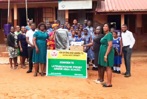 Rhoda Ahenkorah (2nd from right), ASA Savings Branch Manager-Kaneshie Zongo, presenting the items to Vida Anom Amoafo (left), Headmistress; Lartebiokorshie JHS Rhoda Ahenkorah (2nd from right), ASA Savings Branch Manager-Kaneshie Zongo, presenting the items to Vida Anom Amoafo (left), Headmistress; Lartebiokorshie JHS