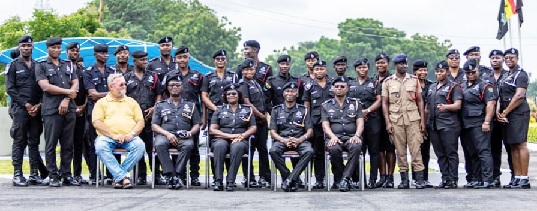 Some members of the Police Band, Heads of security services bands and the vocal workshop trainer, Mr Stephan Flore (seated at far left) 