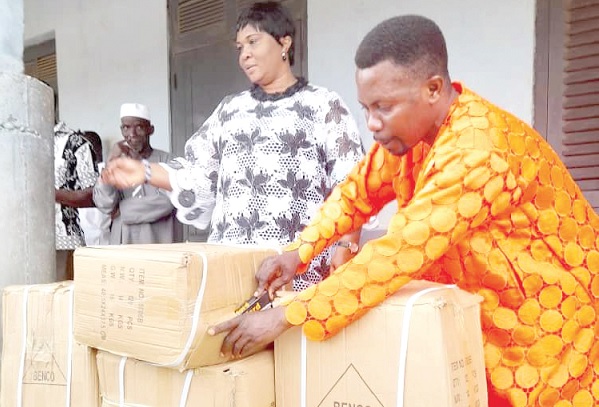 Adelaide Ntim, NPP MP for Nsuta/Kwaman Beposo (left) handing over the mathematical sets