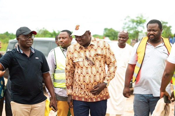 Osei Assibey Antwi (left), Executive Director of the NSS, ushering Dr Bryan Acheampong, Minister of Food and Agriculture, and some other dignitaries to take a tour around the farmland Osei Assibey Antwi (left), Executive Director of the NSS, ushering Dr Bryan Acheampong, Minister of Food and Agriculture, and some other dignitaries to take a tour around the farmland