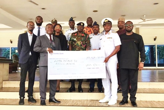 Mawuko Afadzinu (left, front row), Head of Brand and Marketing, Stanbic Bank, handing over the cheque for GH¢95,000 to Air Commodore Eric Agyen-Frempong, a representative of the 1991 Group of the Ghana Military Academy RCC. With them are serving and retired military officers Mawuko Afadzinu (left, front row), Head of Brand and Marketing, Stanbic Bank, handing over the cheque for GH¢95,000 to Air Commodore Eric Agyen-Frempong, a representative of the 1991 Group of the Ghana Military Academy RCC. With them are serving and retired military officers