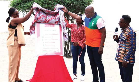 Ato Afful (middle), Managing Director, Graphic Communications Group Limited, being assisted by Yvonne Aryee (left), Senior Corporate Communication Officer, GCGL, to unveil the new core values of the company. Looking on is Emmanuel Arthur (right), Corporate Communications Manager, GCGL. Pictures: ELVIS NII NOI DOWUONA Ato Afful (middle), Managing Director, Graphic Communications Group Limited, being assisted by Yvonne Aryee (left), Senior Corporate Communication Officer, GCGL, to unveil the new core values of the company. Looking on is Emmanuel Arthur (right), Corporate Communications Manager, GCGL. Pictures: ELVIS NII NOI DOWUONA