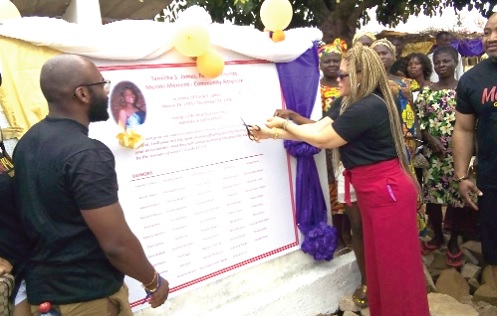 Tamicka James (right) cutting the ribbon to inaugurate the borehole Tamicka James (right) cutting the ribbon to inaugurate the borehole